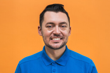 Portrait of the man on orange background. Man's emotions