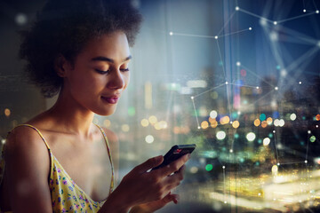 woman chats with friends with her smartphone at home