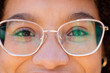 © Wavebreak Media - Closeup portrait of biracial young woman wearing eyeglasses and looking at camera