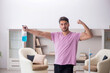 © Elnur - Young male contractor cleaning the house
