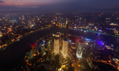 Wall Mural - Night aerial view of skyscrapers in Shanghai with Huangpu river, China