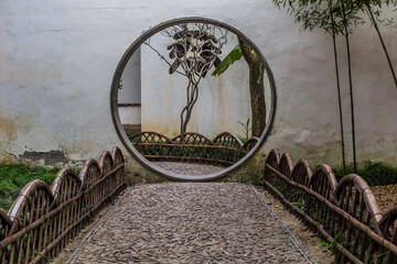 Moon gate in the garden of Blue Wave (Canglang) Pavilion in Suzhou, Jiangsu province, China