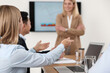 © New Africa - Businesswoman having meeting with her employees in office