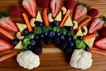 Closeup Fresh Fruit And Veggies Arranged On Butcher Block, Berries & Vegetables Fresh And Healthy Snacking