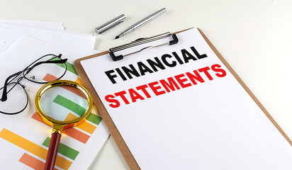 Poster - FINANCIAL STATEMENTS text on clipboard on white background, business concept