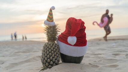 Snowman made of pineapple and watermelon on the beach Healthy Christmas Fruits Funny and cute New Year fruits. Festive food. Summer Christmas concept. white background greeting card design copy space.