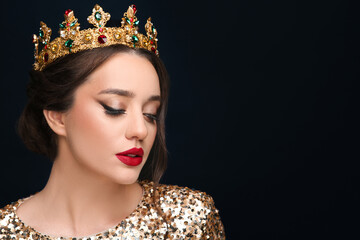 Wall Mural - Beautiful young woman wearing luxurious crown on black background, space for text