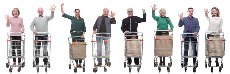 Wall Mural - group of people with shopping cart showing thumbs up at camera