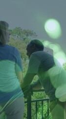 Poster - Animation of light spots over senior diverse couple