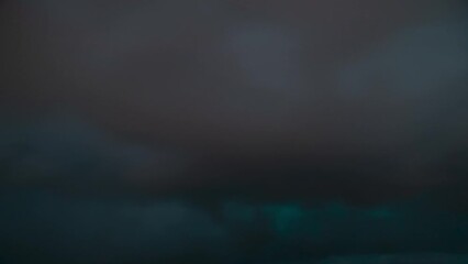 Wall Mural - Time lapse of the aurora borealis (the northern lights) on a cloudy night. Filmed in the village of Back on the Isle of Lewis, part of the Outer Hebrides of Scotland.