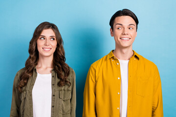 Sticker - Closeup photo of two young best friends smiling toothy enjoy their beaming smile look each other stomatology advert isolated on blue color background