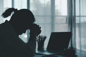 Wall Mural - Stress business woman person from hard work, depression in office. Tired and anxious employee female with unhappy at problem job. young businesswoman sitting sad front of laptop computer on desk.