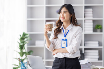 Wall Mural - Cheerful business Asian woman freelancer making telephone call share good news about project working in office workplace, employee business finance concept.