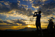 silhouette golfer playing golf with golf bag during beautiful sunset