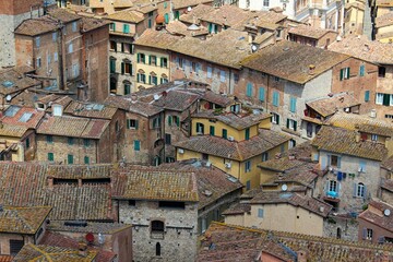 Wall Mural - High-angle shot of the old building roofs of an Italian town.