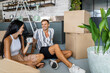 © ADDICTIVE STOCK - Happy couple taking break during relocation