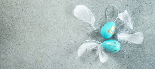 Wall Mural - easter composition. easter eggs with feathers on gray background. happy easter card design. long ban