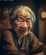 © ADDICTIVE STOCK - Generative AI illustration of positive elderly asian woman in casual clothes with gray hair looking at camera and smiling against blurred interior background