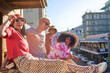 © Caia Image - Portrait happy young friends on sunny urban city balcony