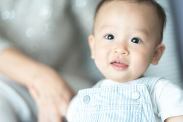 little cute child baby are happy and smile with mother and father at home in family together concept, young childhood having fun laughing and joy to play with parent in a room house lifestyle