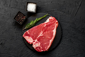 Poster - raw T-bone steak on stone background