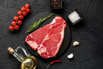 Wall Mural - raw T-bone steak on stone background