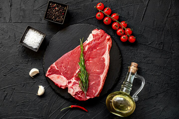 Wall Mural - raw T-bone steak on stone background