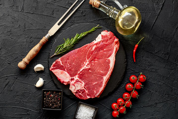 Poster - raw T-bone steak on stone background