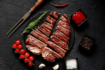 Poster - grilled T-bone steak on stone background