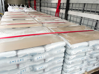 Wall Mural - loading, transportation and unloading of bulk materials in bags of 25 kilograms in a semi-trailer. s