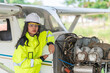 © reewungjunerr - Technician fixing the engine of the airplane,Female aerospace engineering checking aircraft engines,Asian mechanic maintenance inspects plane engine