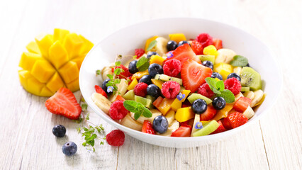 Wall Mural - mixed fruit salad with berries fruits and mango