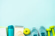 © nadianb - Fitness, workout, healthy lifestyle and clean eating concept. Top view on blue background.