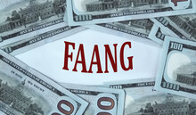 FAANG - acronym on the background of cash dollar bills