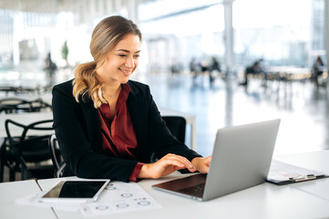 positive satisfied successful influential caucasian business woman, product manager, in elegant clot