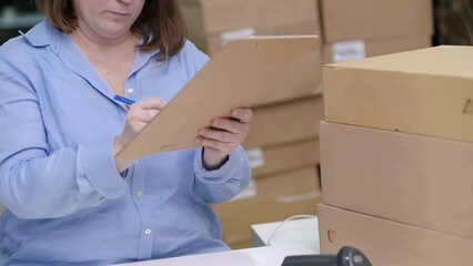 Poster - logistic shipping online orders. small business owner packaging items for delivery at her e-commerce office scanning barcodes to track
