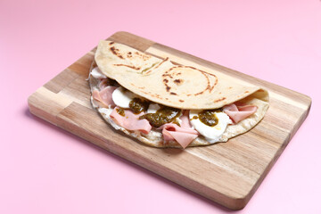 Wall Mural - Italian cuisine , Piadina with Italian ham and cheese