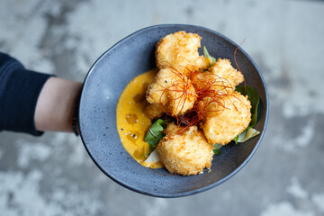 Sticker - Fried vegetarian balls served in bowl