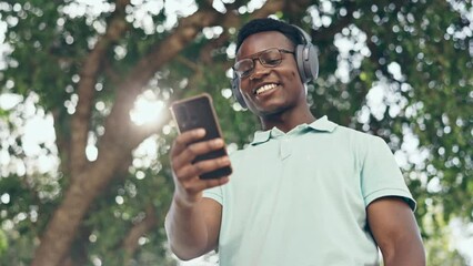 Canvas Print - Wave, phone video call or black man in a park walking, talking or speaking in communication with a smile. Happy, hello or African businessman networking in conversation on commute via mobile app