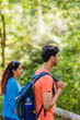 © Sangiao_Photography - mixed race couple trekking in senda del oso, Asturias. Mid adult ecotourism in Proaza