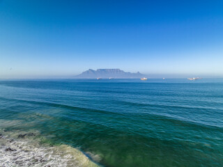 Poster - Aerial view of table mountain with ships in foreground