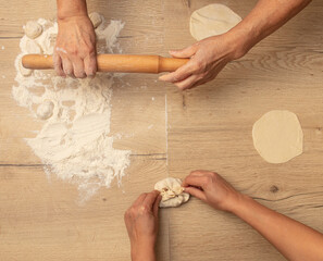 Poster - Cooking dough with meat on the table.