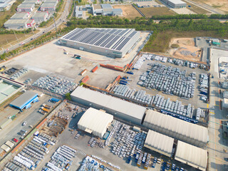 Aerial top view of industry factory in urban city town. Inventory import and export business commercial, Automobile and automotive industry distribution logistic transport.