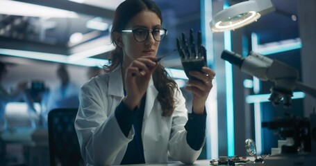 Poster - Portrait of a Young Female Scientist Working in Technological Research and Development Company, Assembling an Innovative Bionic Prosthetic Hand. Engineer Working on Technology for Physically Impaired