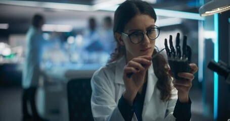 Poster - Beautiful Young Female Scientist Working on a Prosthetic Robotic Hand. Focus Switching to a Diverse Team of Industrial Specialists Working on Advanced Remotely Controlled Mobility Robot Dog