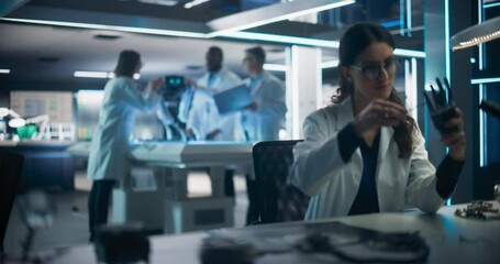 Poster - Talented Young Female Scientist Working on a Prosthetic Robotic Hand. Focus Switching to a Diverse Team of Industrial Specialists Working on Advanced Mobility Robot Dog with Artificial Intelligence