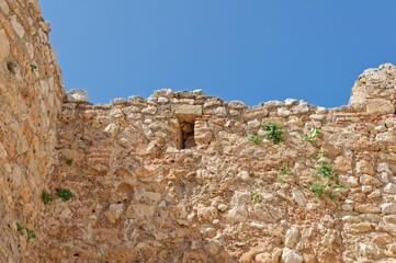 Canvas Print - Old wall of a castle against a blue sky