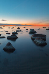 Wall Mural - Sunset long exposure on the Baltic sea coast with boulders