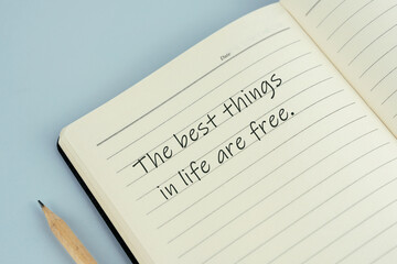 Wall Mural - Inspirational quotes written on note pad - The best things in life are free