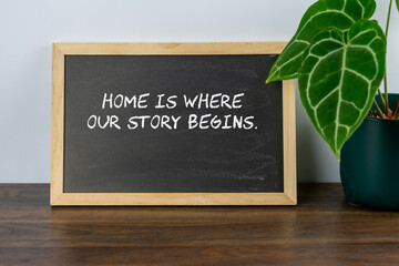 Wall Mural - Inspirational quote text Home is where our story begins on mini chalk board
